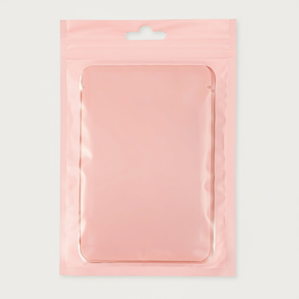 A clear plastic packaging with a hanging hole, containing a pink gel product, presumably the lash shampoo concentrate.